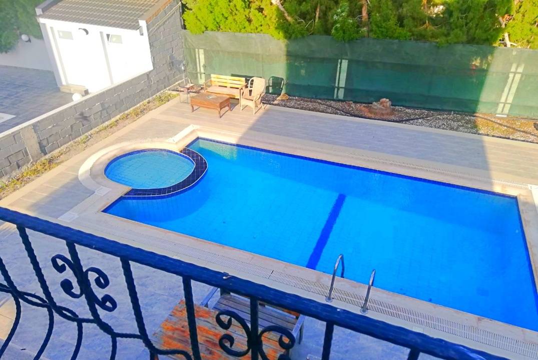 A house with a swimming pool is located in the village of Lapta