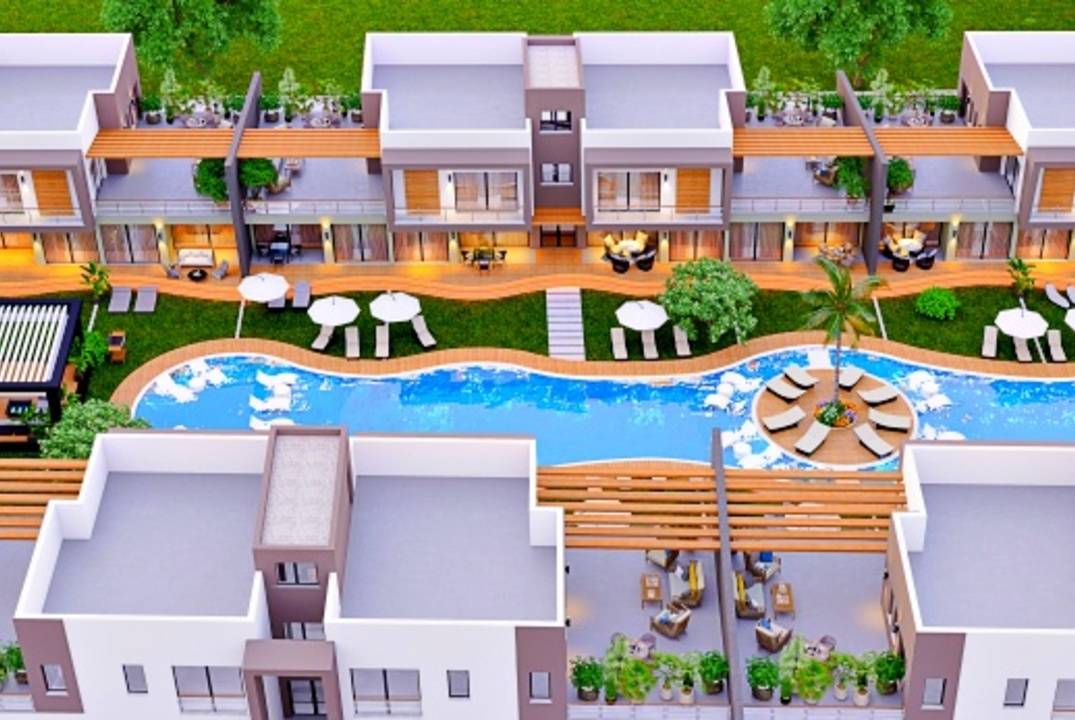 Apartments 2+1 with a private garden and a terrace in a residential complex in Otyuken, in Iskele